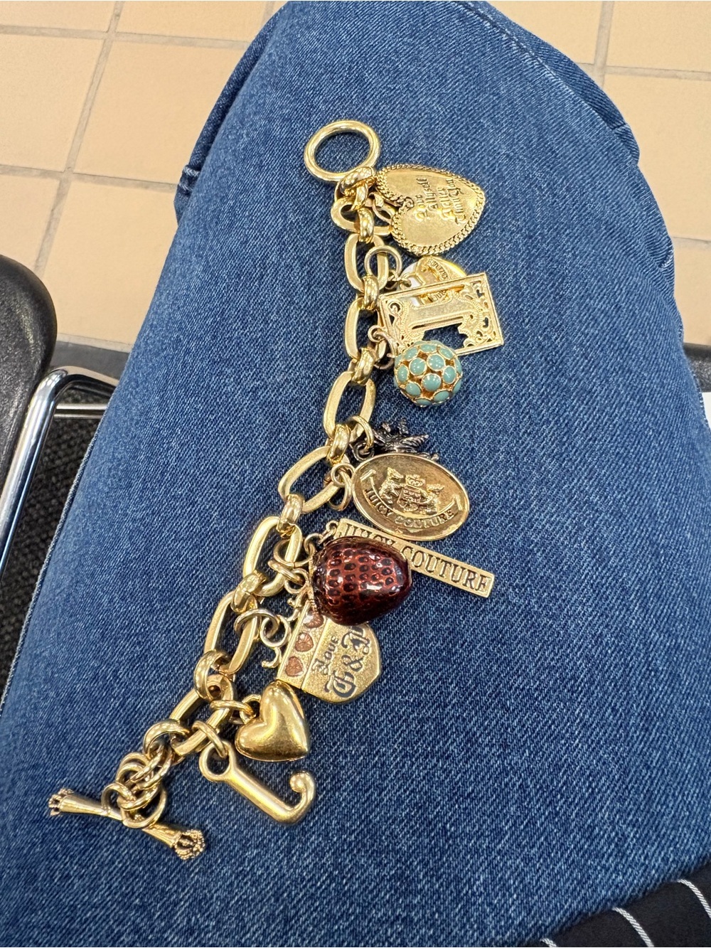 Juicy Couture Gold Charm Bracelet with Turquoise and Red Accents